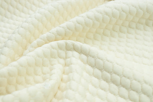 a close up view of a white blanket