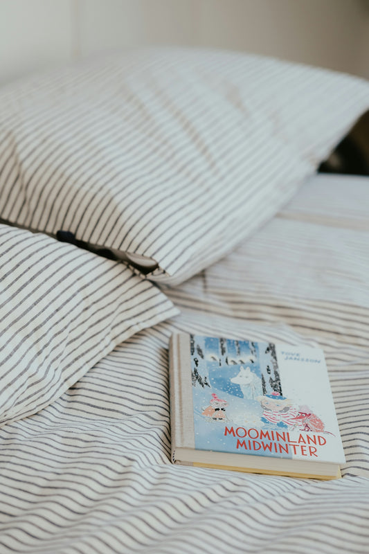 a book and a book on a bed