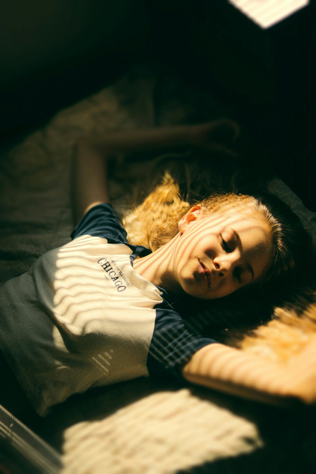 a person lying on a bed