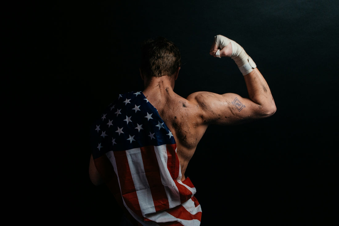 a man with an american flag towel on his back
