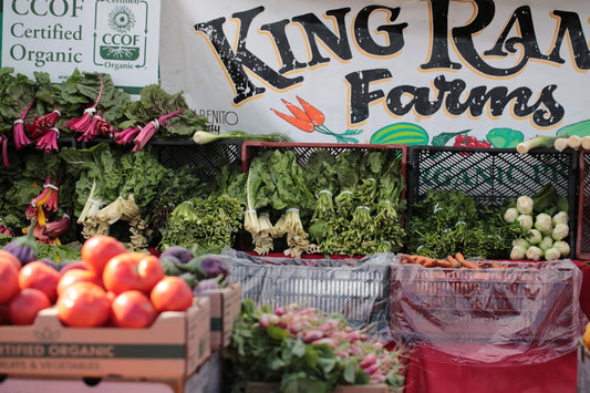 Fresh organic produce displayed at king ranch farms stand.